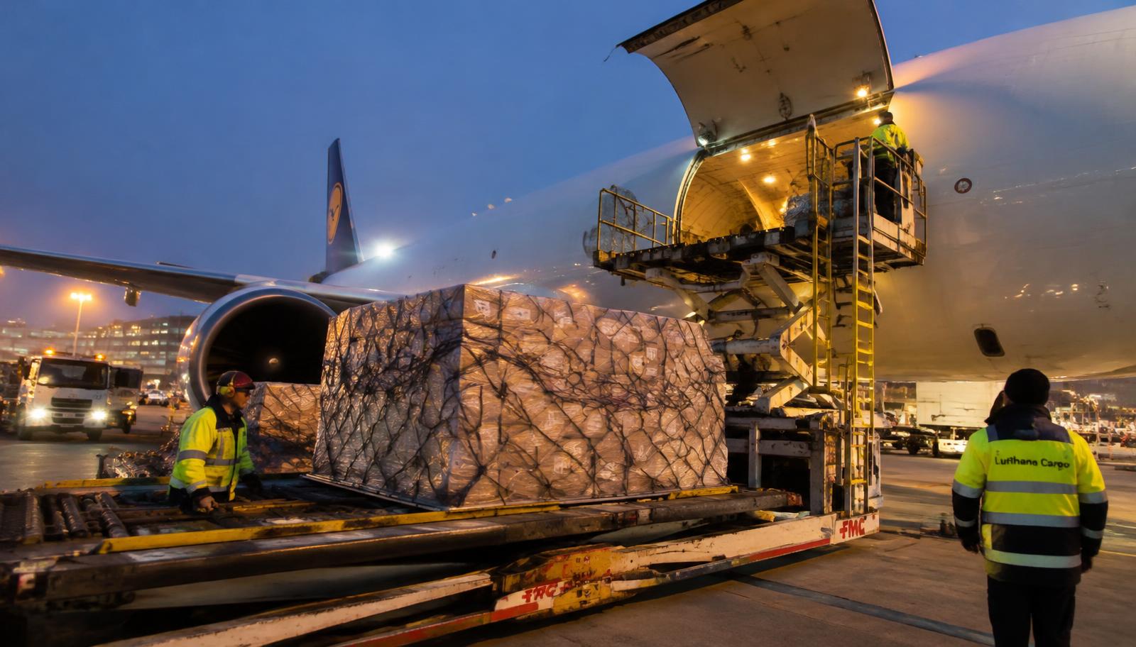 Export cargo pallet being loaded into an aircraft